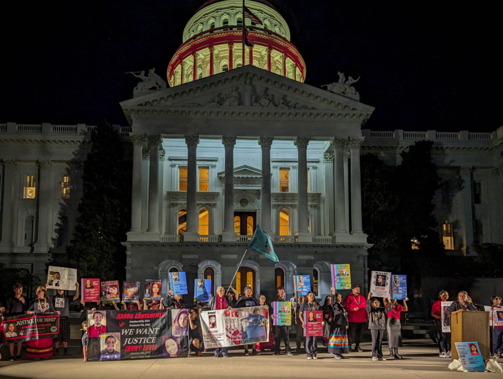 People with MMIP banners in front of the Capitol.